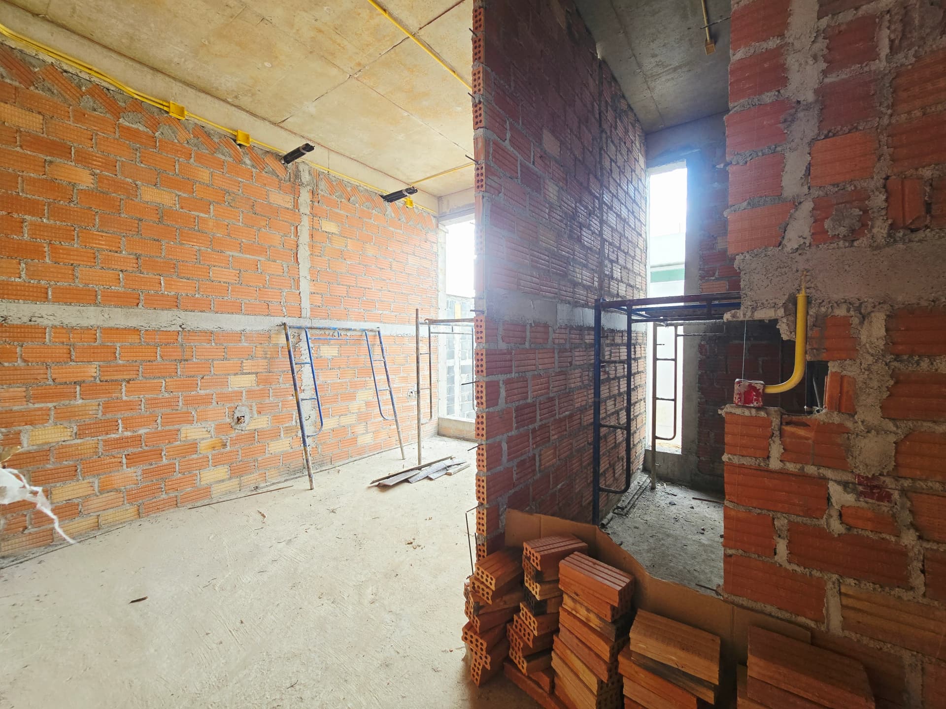 MONO Champaca construction progress, 26 August 2026 · interior masonry and services